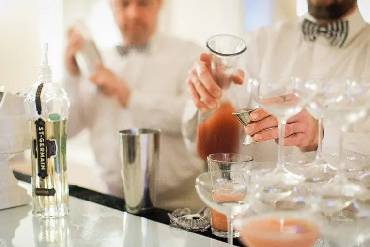 Two bartenders serving drinks | Lisa Dupar Catering | Wedding & Event Catering in Seattle