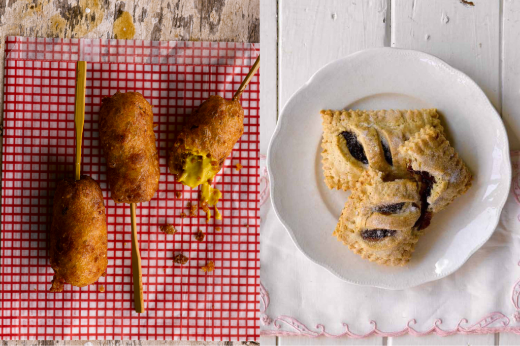 Seattle Catering Three corn dogs are arranged on a red checkered paper with mustard, and three pastries are placed on a white plate on a white tablecloth, perfect Back-to-School Treats.