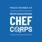 Seattle Catering Blue logo reading "Proud Member of World Central Kitchen Chef Corps" with a magnifying glass over a globe illustration, highlighting our expertise in wedding and event catering.