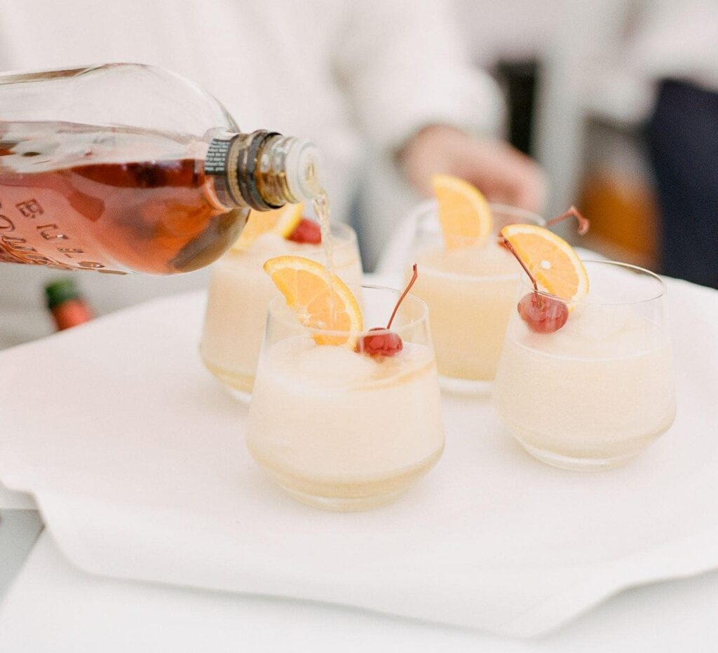 Bartender pouring Whiskey Sour Cocktails | Lisa Dupar Catering, Wedding Catering in Seattle, WA