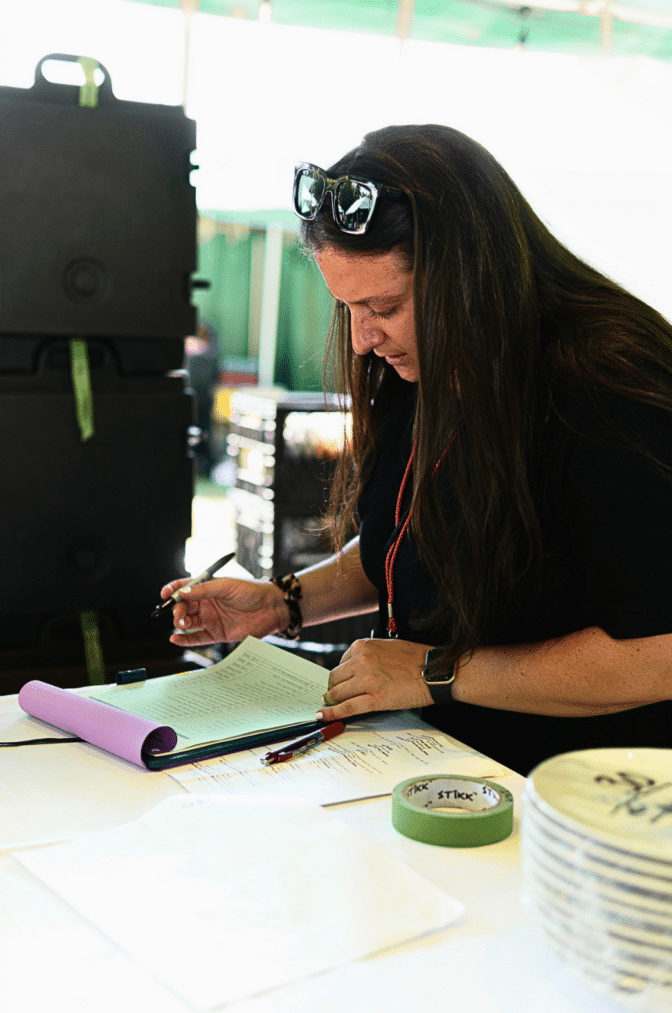 Dana a Lisa Dupar Event Planner reviewing her run of show check list for the event
